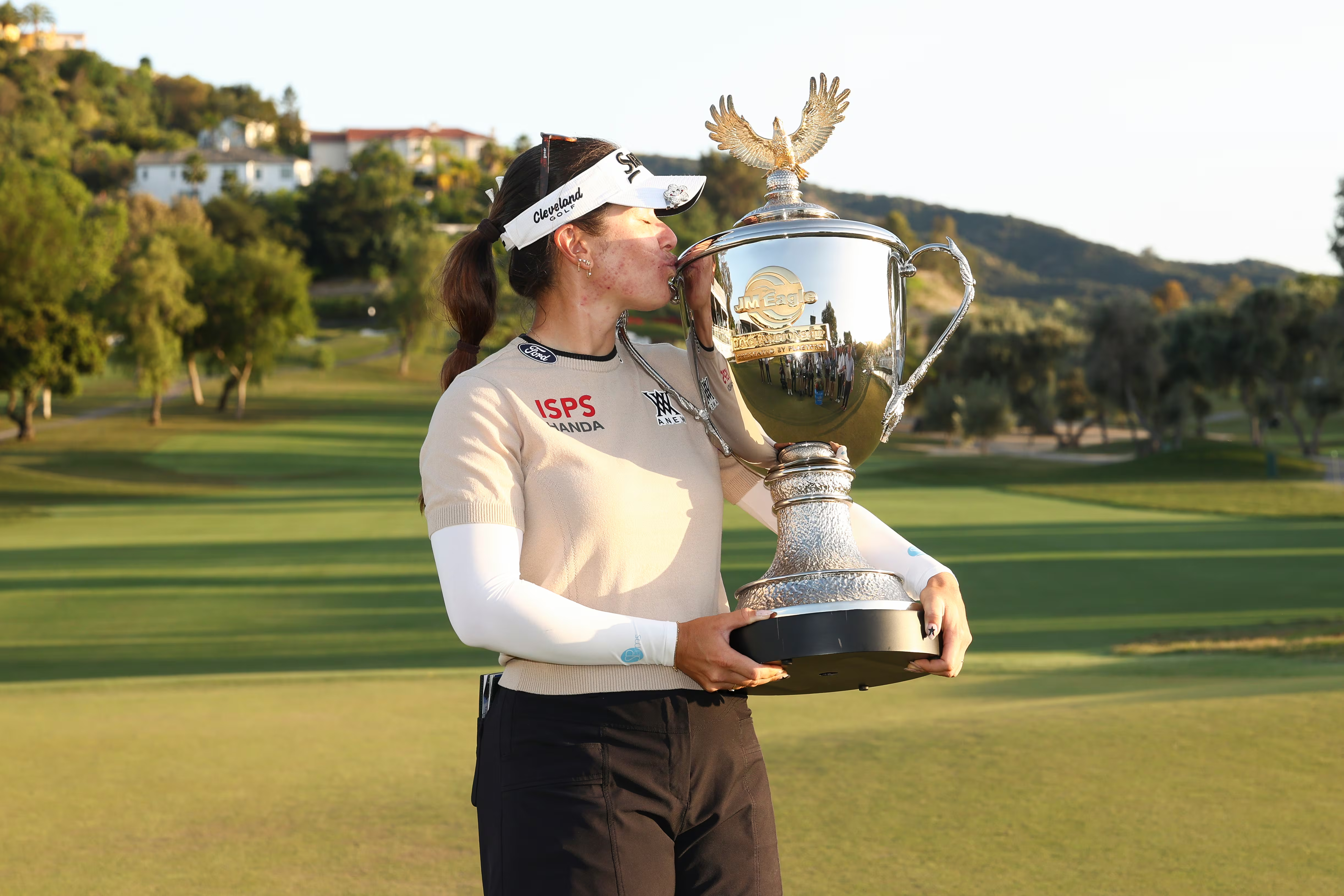 JM Eagle LA Champion three-time winner Hannah Green with trophy made by Malcolm DeMille